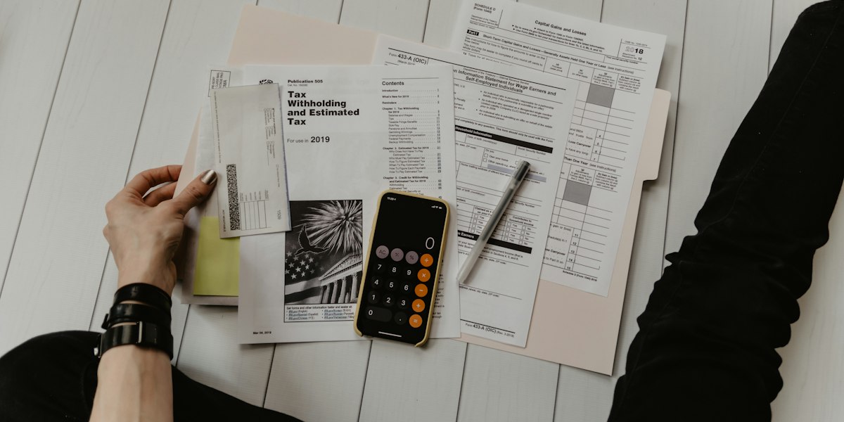 Calculator and documents on a desk